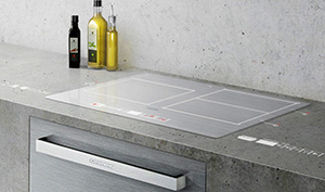 Technologie Grundig VUX : projection d'informations et de boutons de commande sur une table de cuisson et un plan de travail � partir d'une hotte