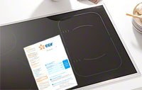 Visuel d'une facture EDF / GDF relative à une table de cuisson Illustration d'une table de cuisson avec une facture EDF