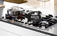 Photo d'une table de cuisson à gaz - (crédit : Miele) Illustration d'une table de cuisson à gaz